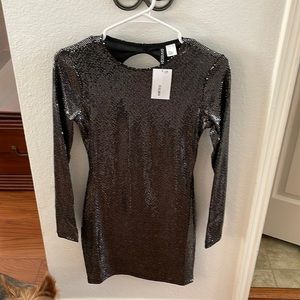 H&M NWT black with silver body skimming dress with back cutout.